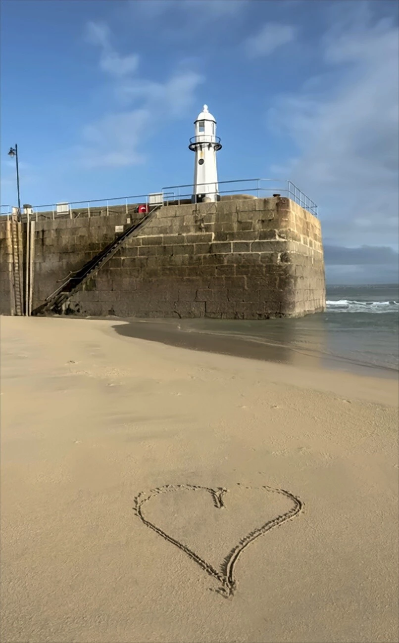 Heart drawn in sand