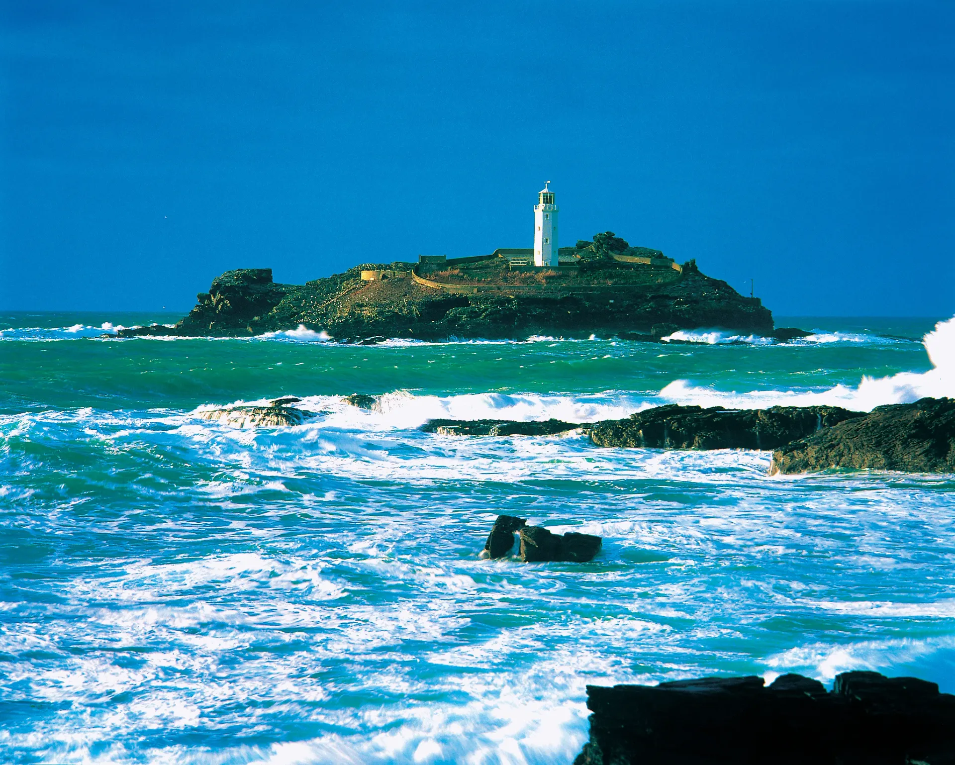 A calm, clear view of Godrevy Lighthouse